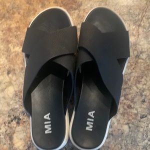 Black Sandler with white soles. Slightly worn. Very cute and comfy.